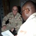 Retention Counselor Explains Benefits to Supply Sergeant in Iraq