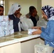 Bank Worker Exchanges Old Iraqi Currency for New Dinars in Mosul