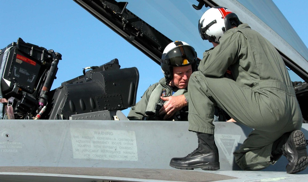 Navy Pilot Assists Joint Chiefs Chairman in Super Hornet Familiarization Flight