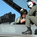 Navy Pilot Assists Joint Chiefs Chairman in Super Hornet Familiarization Flight