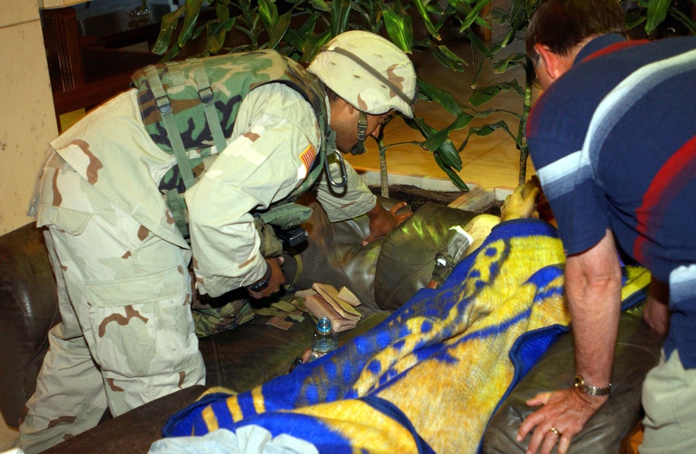 U.S. Soldier Checks on Injured After Attack on Baghdad Hotel