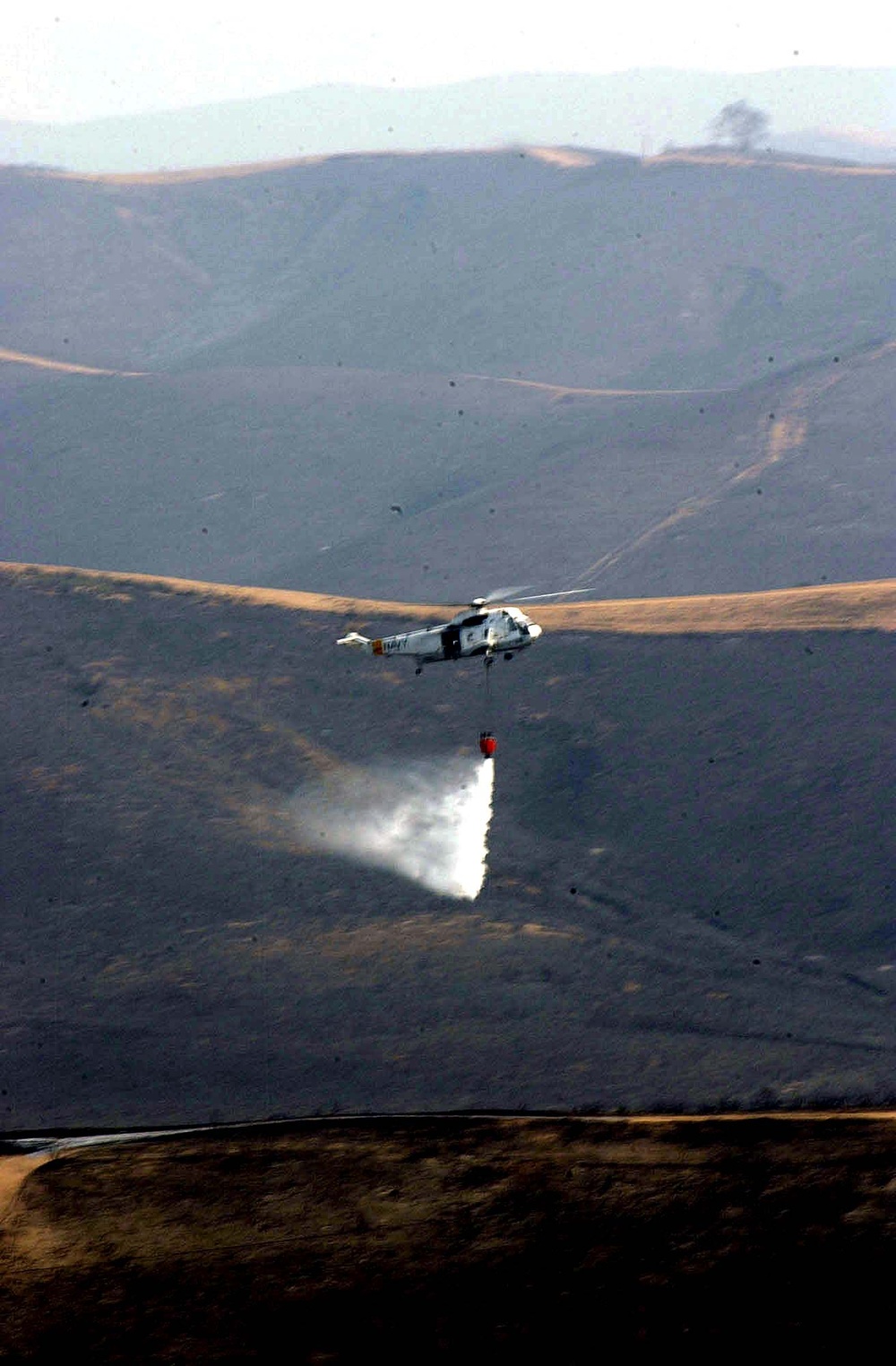 Navy Helicopter Assists in Battling Devastating Southern California Brushfires