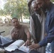 Army Engineer Collaborates with Afghan Interpreter at Jalalabad Reconstruction Site