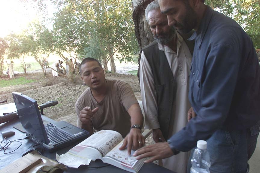 Army Engineer Collaborates with Afghan Interpreter at Jalalabad Reconstruction Site