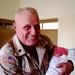 U.S. Military Officer Holds Newborn Iraqi Detainee's Baby