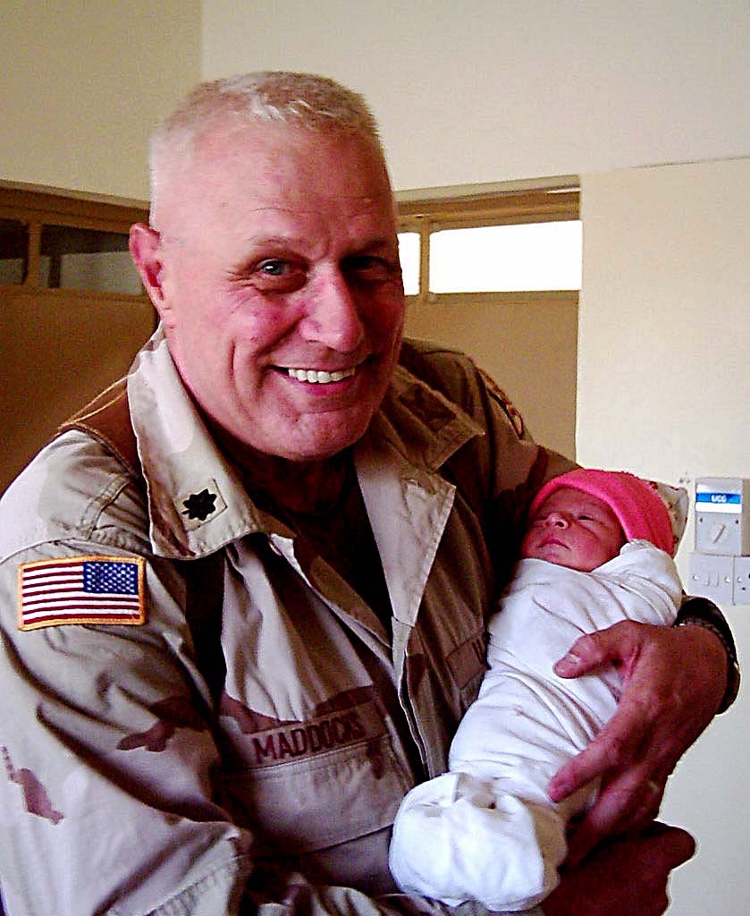 U.S. Military Officer Holds Newborn Iraqi Detainee's Baby