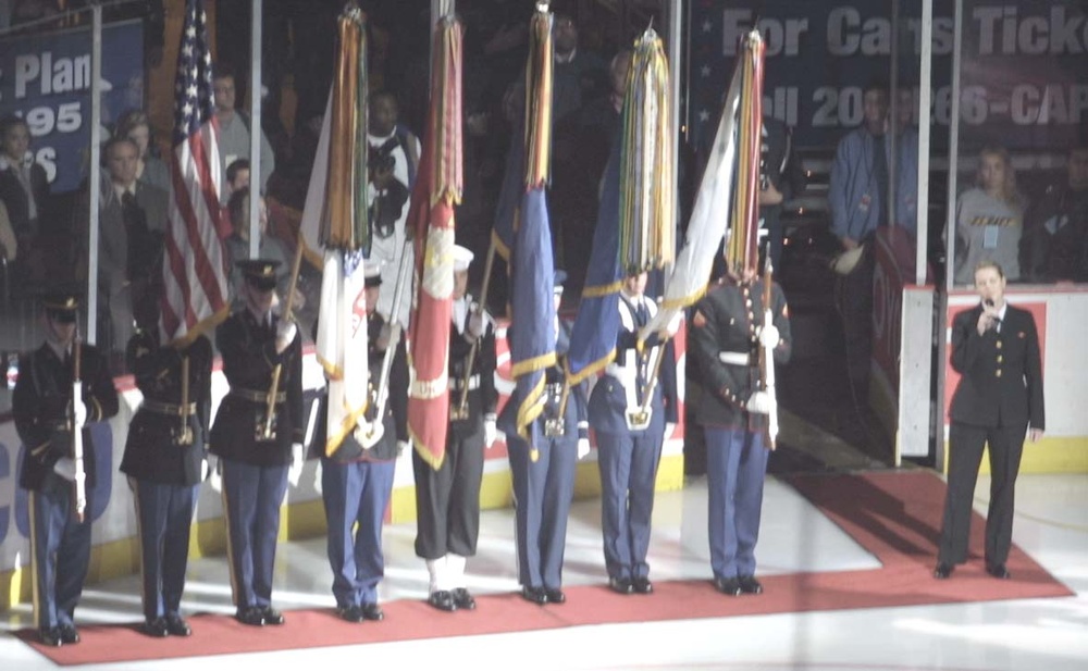 U.S. Armed Forces Joint Color Guard Presents Colors as Navy Musician Sings National Anthem at Capitals Game