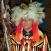 Odawa Tribe Member Carries Eagle Staff in Veterans Powwow Procession