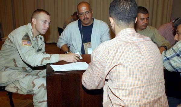 Soldier Assists with Iraqi Police Recruitment in Baghdad