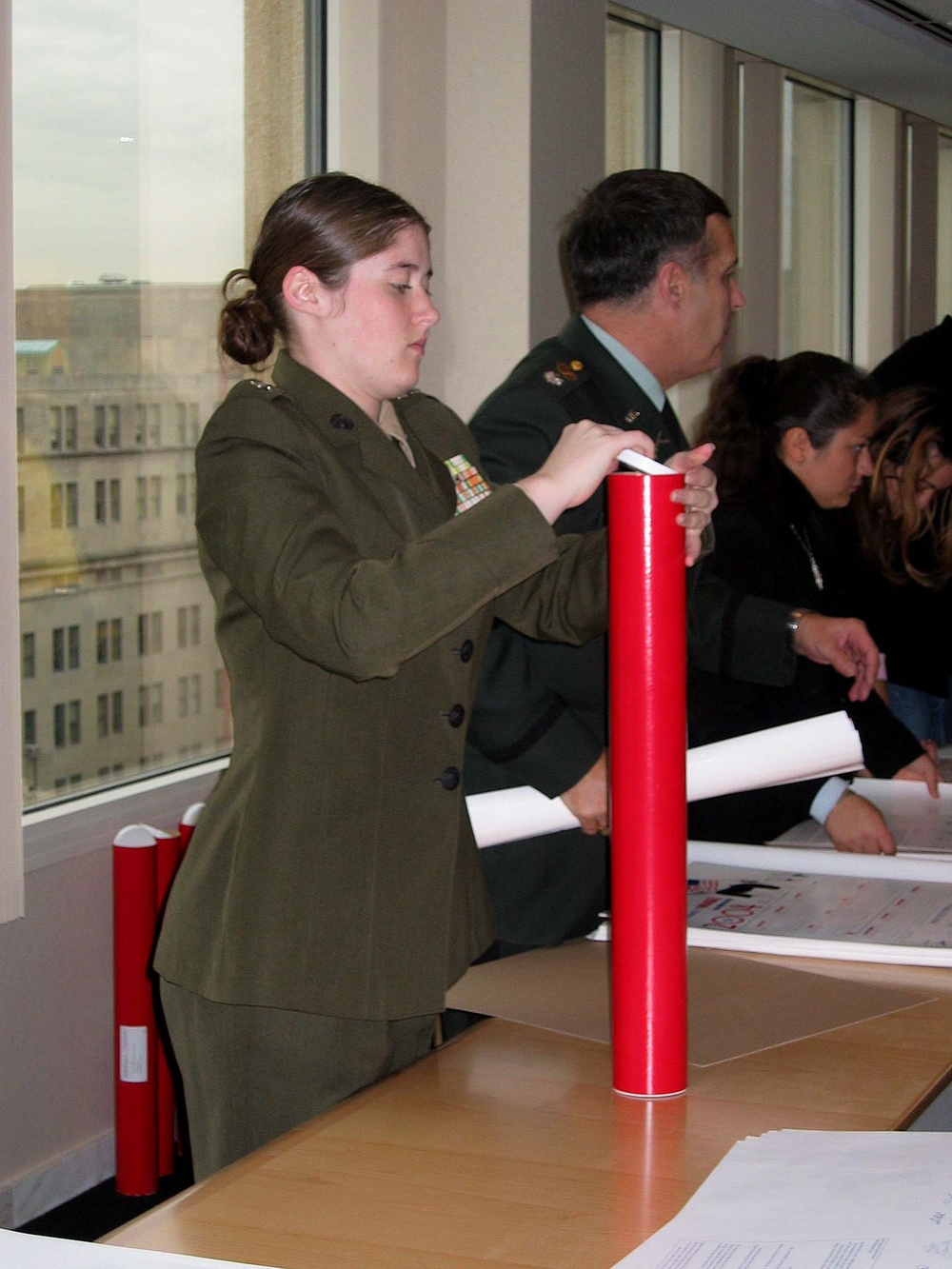 Junior ROTC Cadets Pack Calendars for Deployed Troops