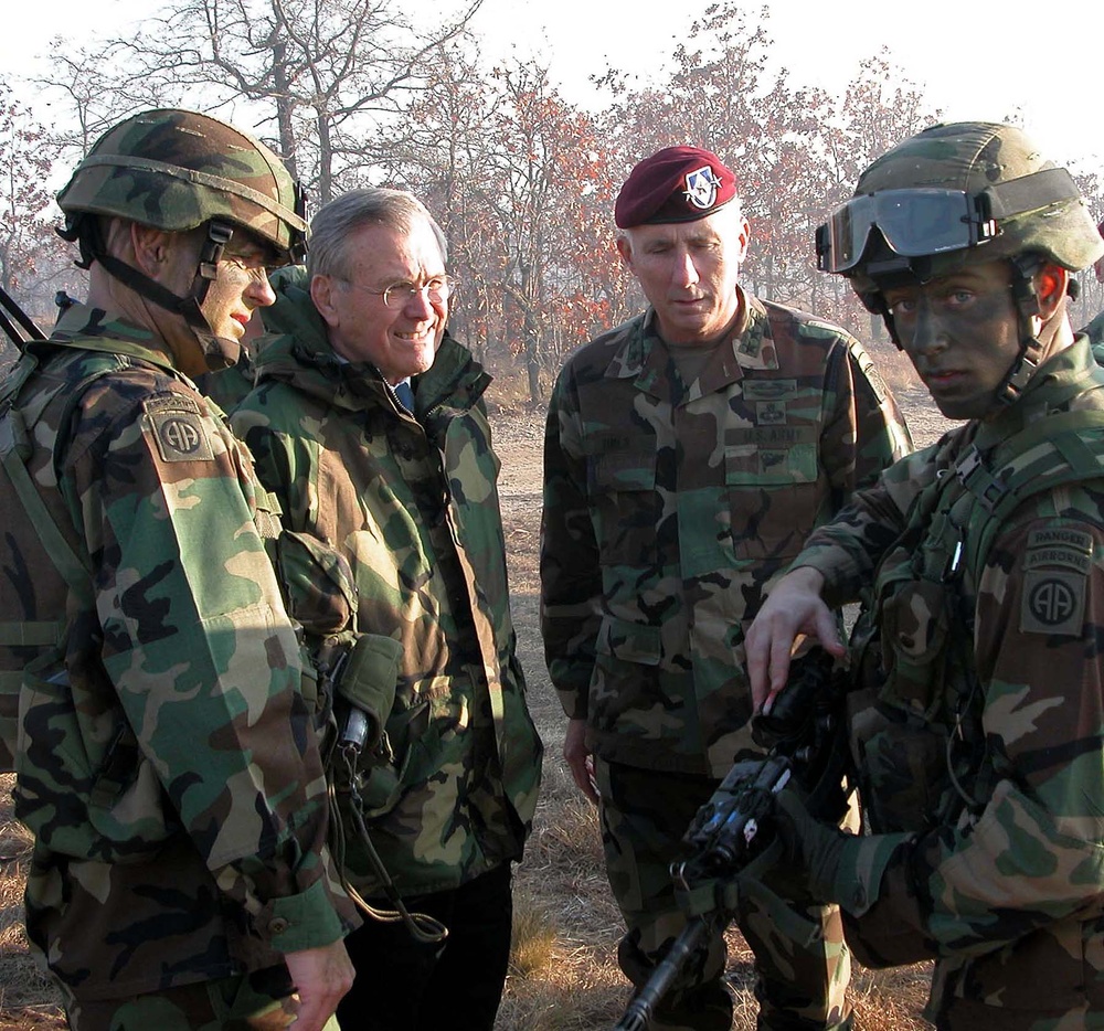 Sgt. Oliver Sliva Demonstrates Carbine Rifle to Defense Secretary Rumsfeld
