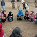 U.S. Troops Engage Afghan Children in Playful Game at Orphanage