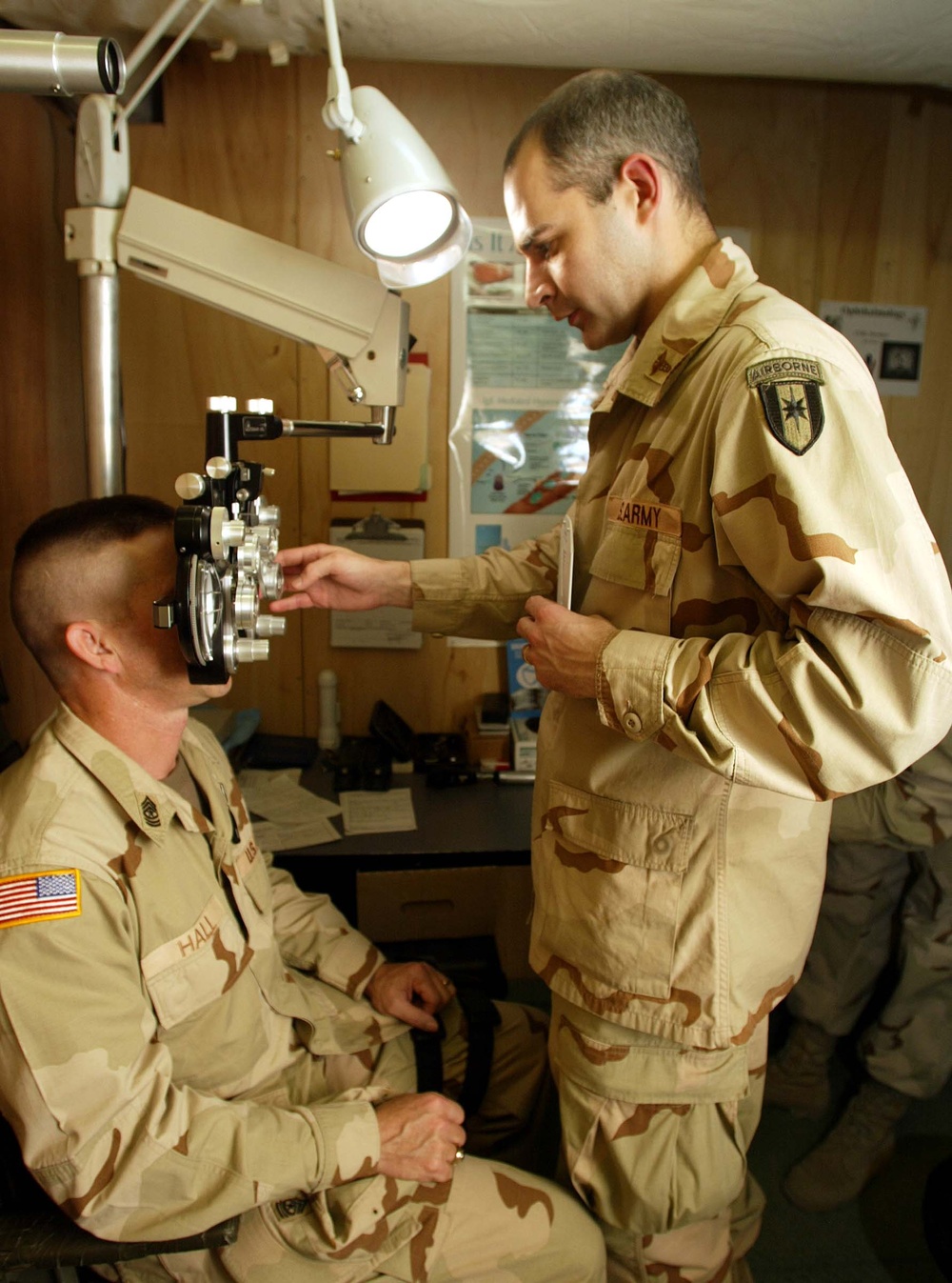Army Ophthalmologist Examines Senior Noncommissioned Officer in Afghanistan