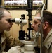 Army Ophthalmologist Examines Soldier's Eyes at Bagram Clinic