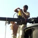 Soldiers Prepare Chinook Helicopter for Shipment in Kuwait