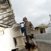 Military Police and Working Dog Inspect Truck at Camp Stronghold Freedom