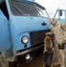 Military Police and K-9 Unit Inspect Truck for Explosives at Camp Stronghold Freedom
