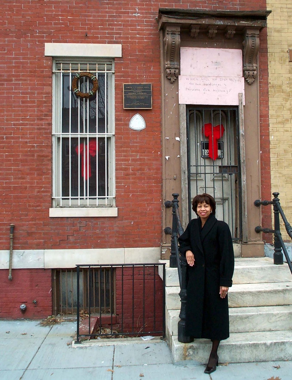 Sylvia Cyrus-Albritton Poses at Historic Carter G. Woodson House