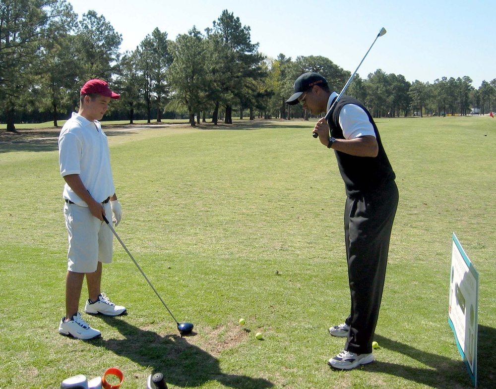 Tiger Woods Provides Golf Instruction to Son of Army Command Sergeant Major