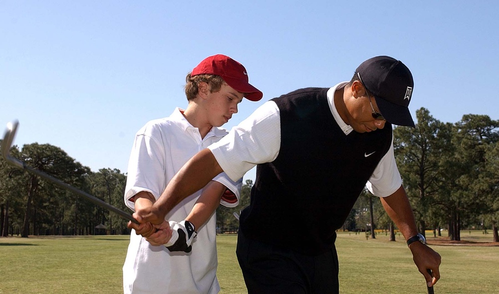 Tiger Woods Mentors Young Golfer Ty Boley at Fort Bragg Clinic