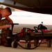 Airman Replaces Flat Tire on C-130 During Iraqi Freedom Mission