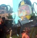 Navy Divers Wave from Underwater Tank at Public Service Expo