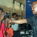Young Boy Explores Police Equipment at Public Service Expo