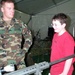 Army Ranger Showcases Weaponry to Student at Public Service Expo