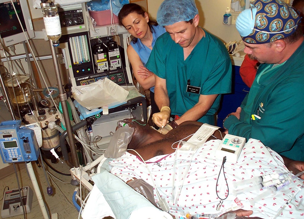 Doctors Administer Regional Anesthesia Nerve Block to Wounded Soldier