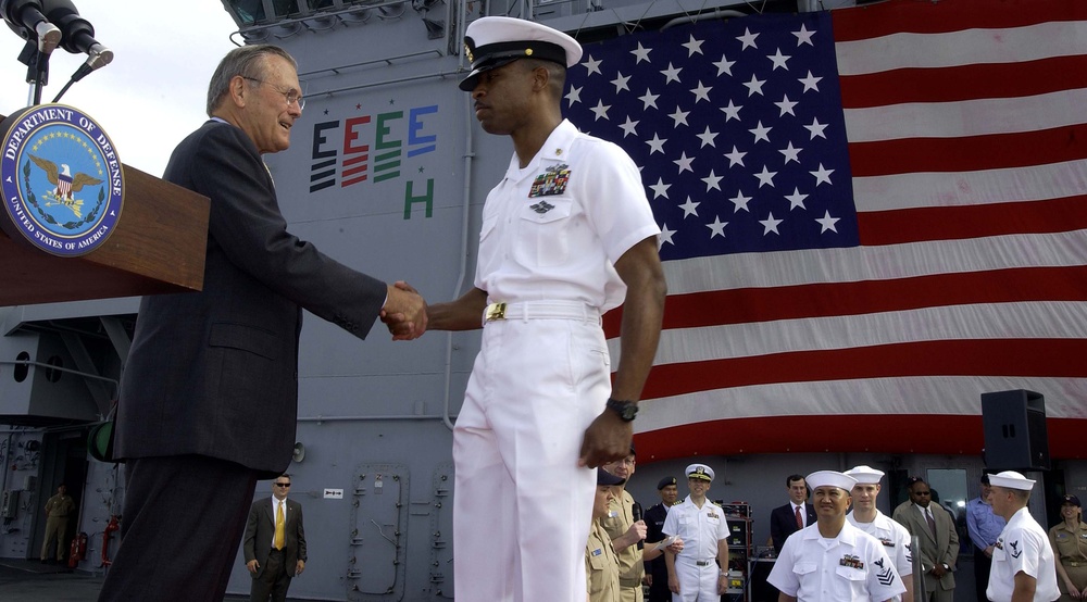 Rumsfeld Congratulates Sailor on Re-Enlistment Aboard USS Essex in Singapore