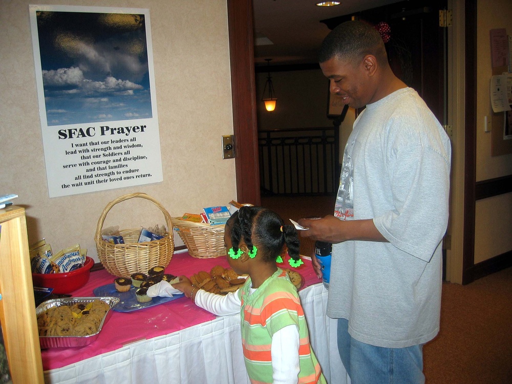 Soldier and Daughter Enjoy Community-Donated Treats