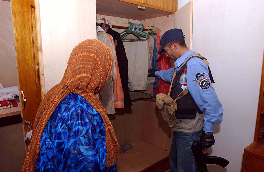 Iraqi Police Conduct Raid, Seize Weapons Cache