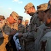 Army Gen. Abizaid Signs Iraqi Flag for U.S. Troops in Baghdad
