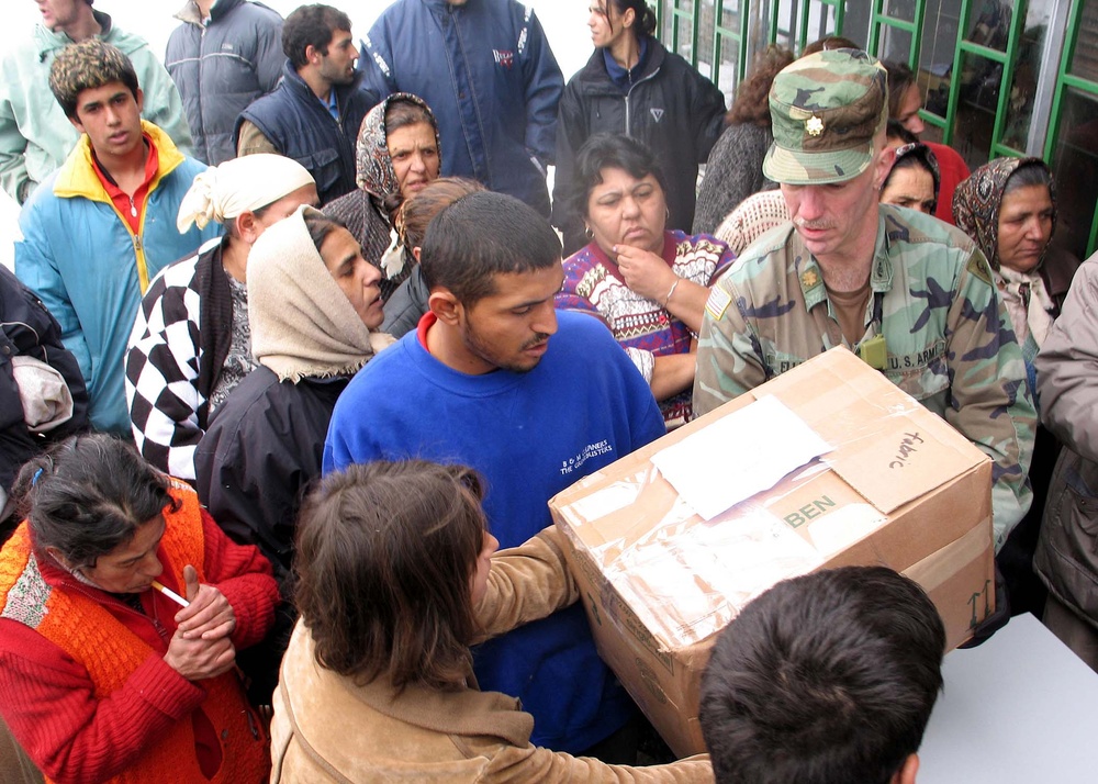 U.S. Army Major Distributes Aid to Needy Families in Kosovo