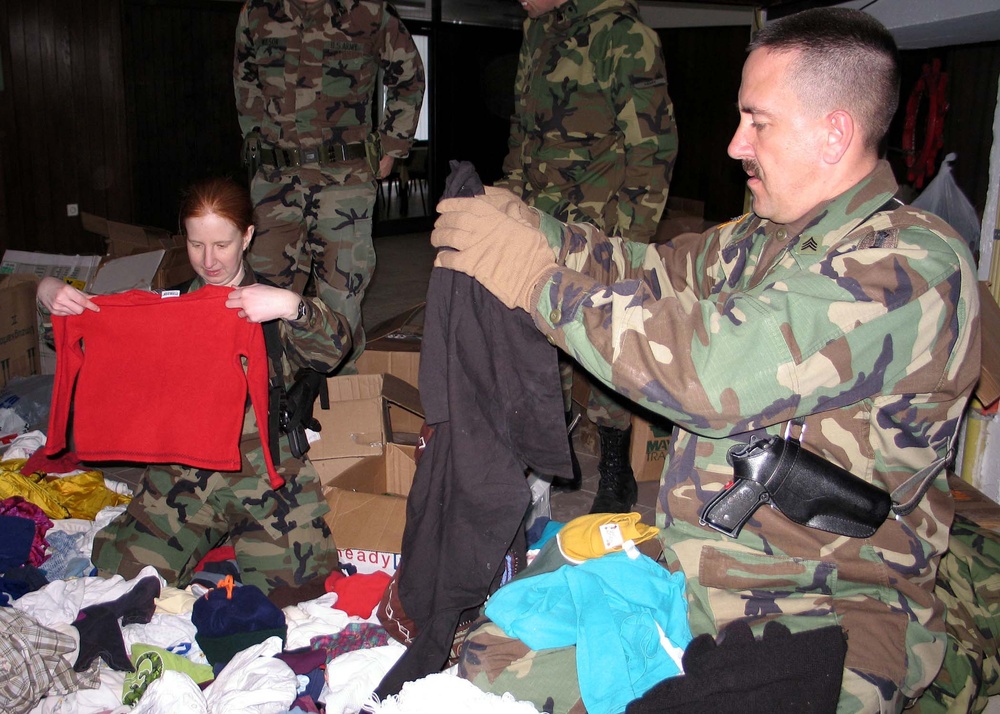U.S. and Allied Troops Prepare Aid Donations for Kosovo Villages