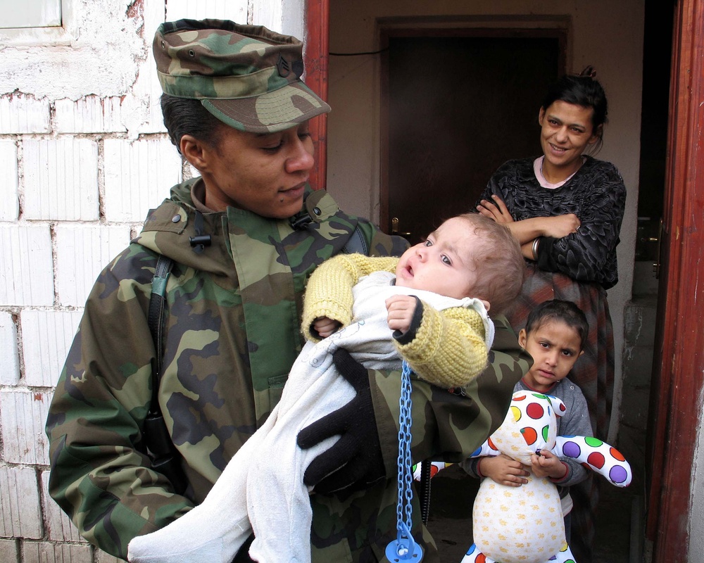 U.S. Soldier Comforts Kosovo Resident During Humanitarian Mission