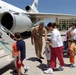 Rear Admiral Encourages Evacuated Families Boarding Flight Home from Italy