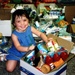 Young Girl Helps Pack Boxes for SI Yellow Ribbon Campaign