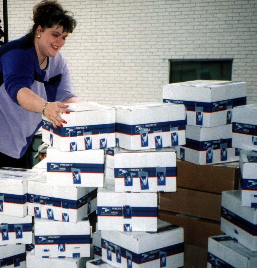 Volunteer Coordinator Prepares Care Packages for Overseas Shipment