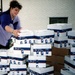 Volunteer Coordinator Prepares Care Packages for Overseas Shipment