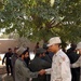 U.S. Soldier Congratulates Afghan Policeman After Training Course
