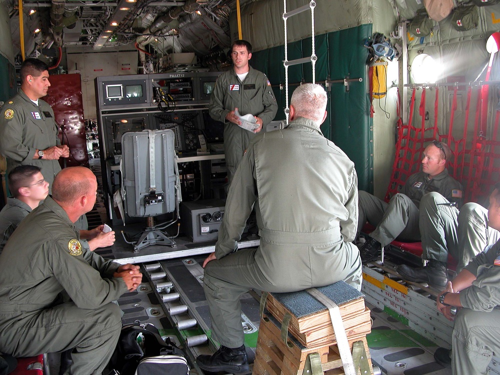 Coast Guard Pilot Briefs Crew Before Search and Rescue Mission