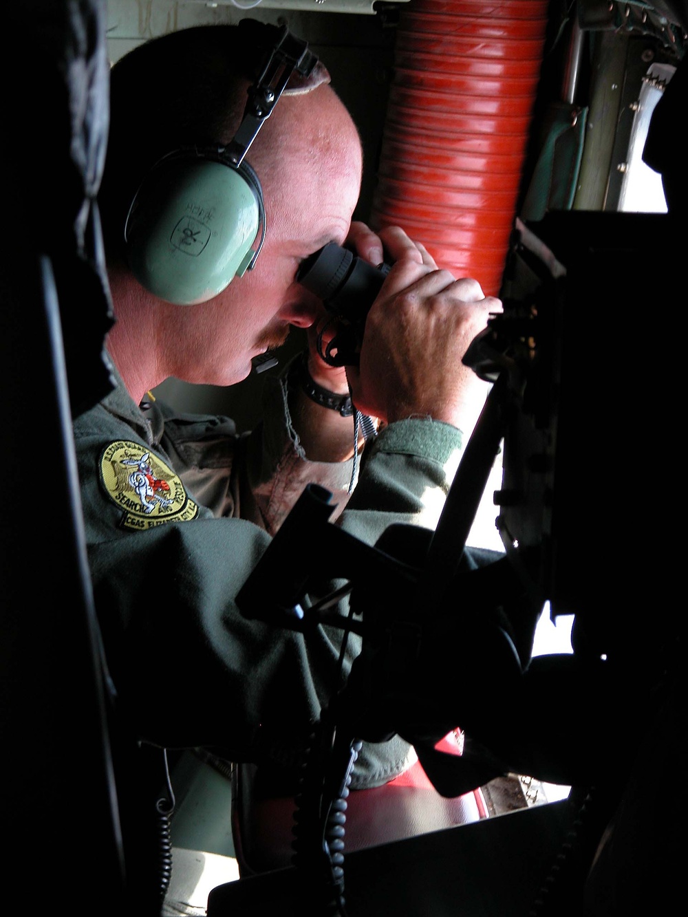 Coast Guard Loadmaster Scans for Person in Water