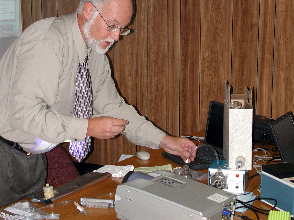 Microbiologist Demonstrates Compact Water Contaminant Analyzer