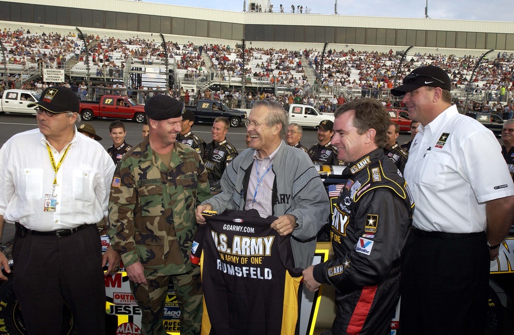 Rumsfeld Receives Army T-Shirt at NASCAR Race