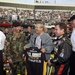 Rumsfeld Receives Army T-Shirt at NASCAR Race