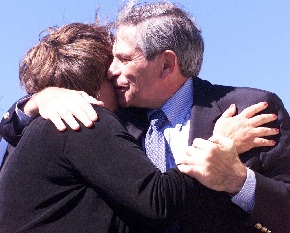 Wolfowitz Embraces Widow of 9/11 Pentagon Victim at Totem Pole Ceremony
