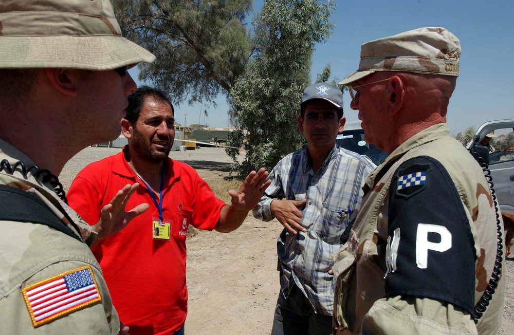 Army Sgt. Communicates with Contract Drivers at Logistics Support Area in Iraq