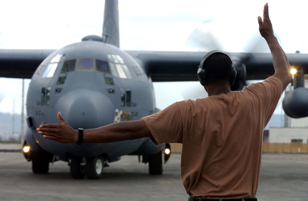 Air Force Airman Marshals C-130 Hercules in Rwanda for Humanitarian Mission