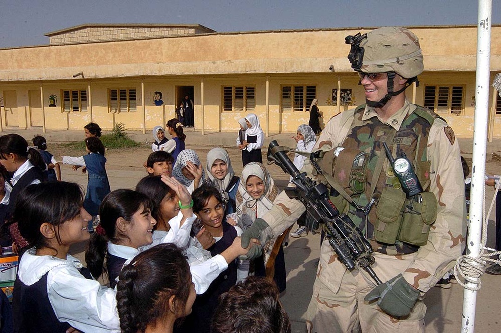 Iraqi Students Surround U.S. Soldier During School Visit